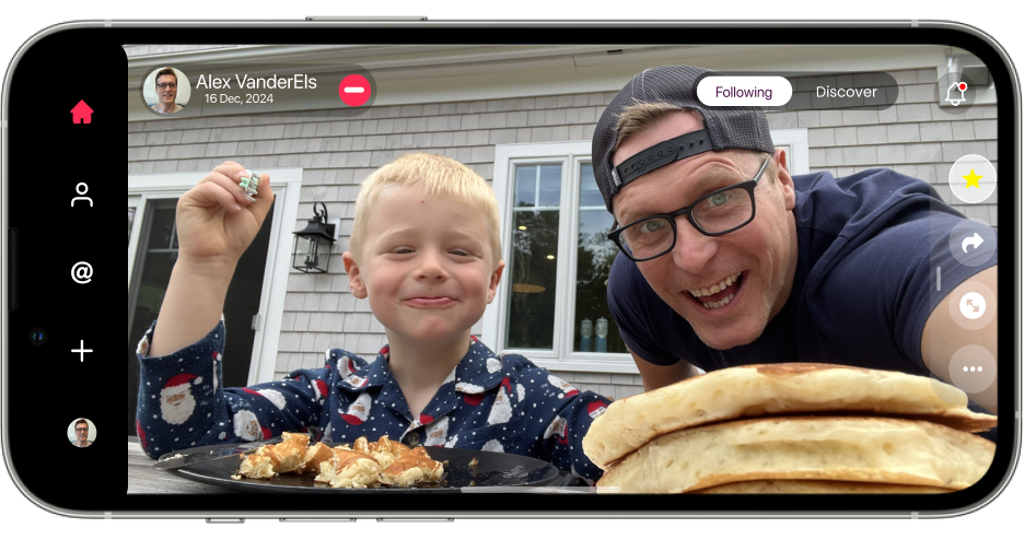 A father and son with a stack of pancakes, shown full width