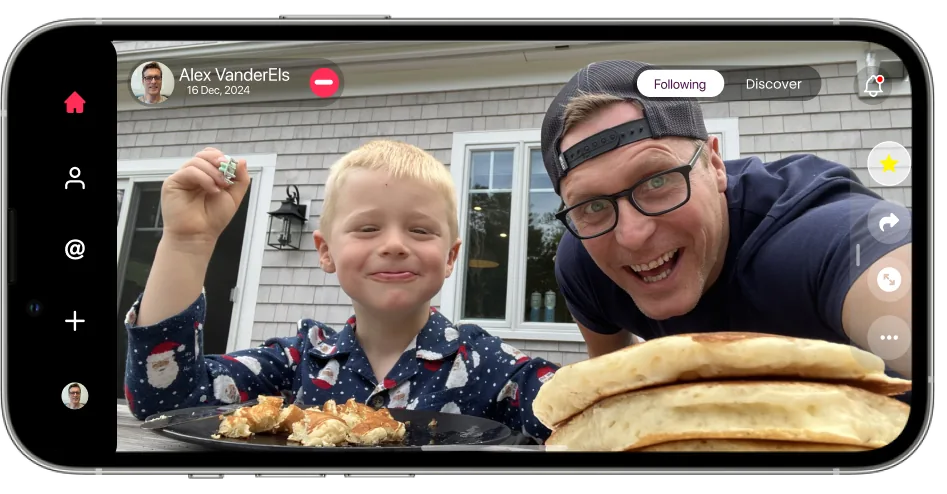 A father and son with a stack of pancakes, shown full width