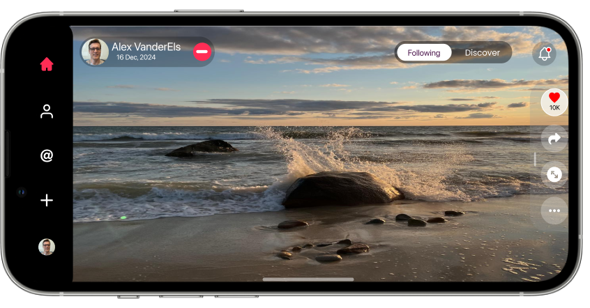 A wave breaking over rocks at golden hour, shown full width