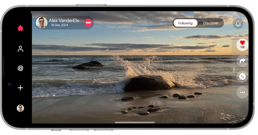 A wave breaking over rocks at golden hour, shown full width